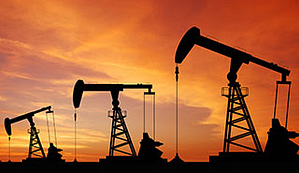 A photo of three oil rigs working at sunset; image used for event page about TXCPA Houston Energy Conference