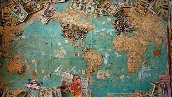 a world map with different international currencies; image used for blog post about not-for-profit international activity