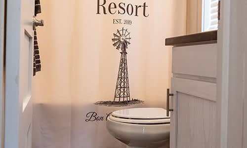 toilet in a tiny house for rent in piney river rv resort