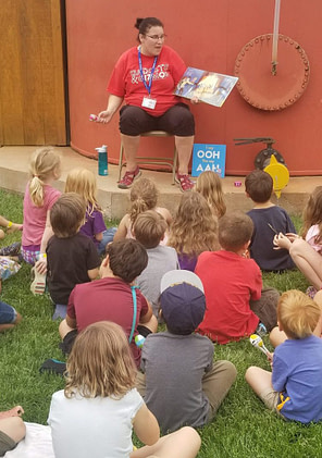 Roadschooling - How To Homeschool While RVing - Fulltime Families Roadschool students listen to a story