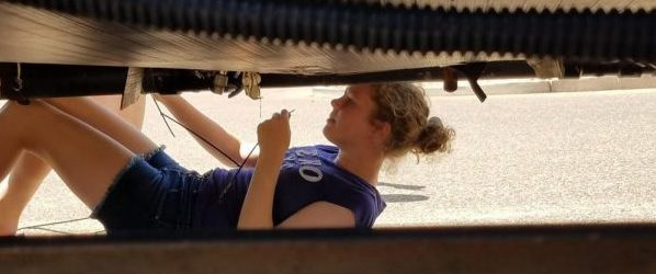 Roadschooling - How To Homeschool While RVing - Fulltime Families Unschooled roadschooler helps with repair