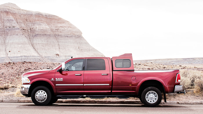 How To Become A Full-Time RV Family - Fulltime Families Side profile of Ram 3500 with a Cowntown Sleeper | Extra seating for full-time rv living family | fulltime families