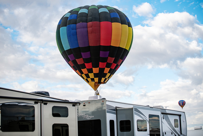 Hot air balloon flying over a 5th wheel RV | full-time rv living family | fulltime families