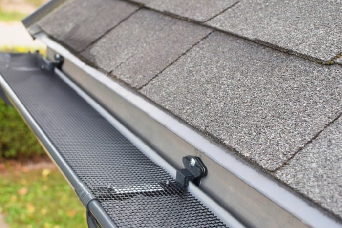 Black mesh gutter guard installation in an East Texas home