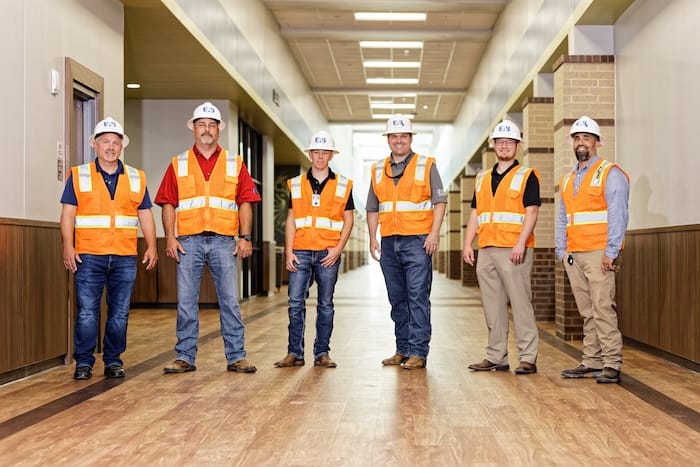 EAB commissioning engineers wearing safety vests and hard hats