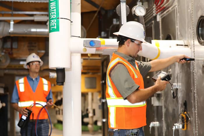 Engineered Air Balance team verifying system performance during a LEED commissioning process