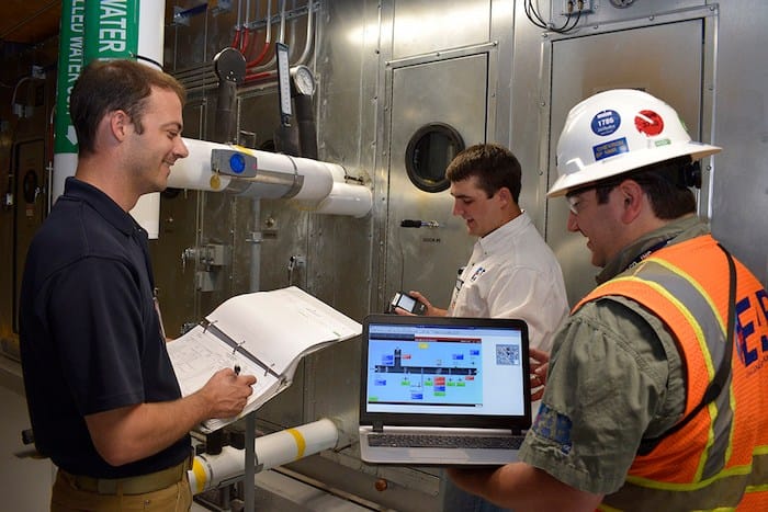 EAB Cx engineers performing system checks and validating commissioning plan requirements