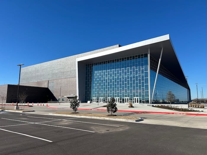 Exterior view of the Fort Bend Epicenter building with its modern glass facade and geometric design