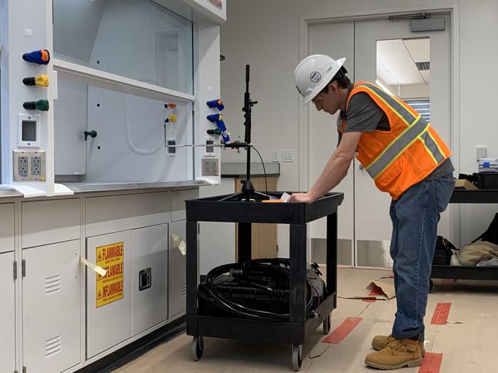 EAB engineer performing laboratory equipment validation during the building commissioning process