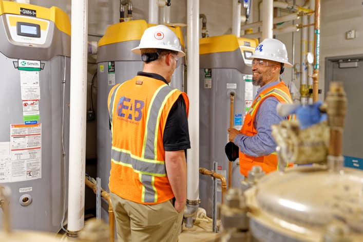 two EAB commissioning engineers