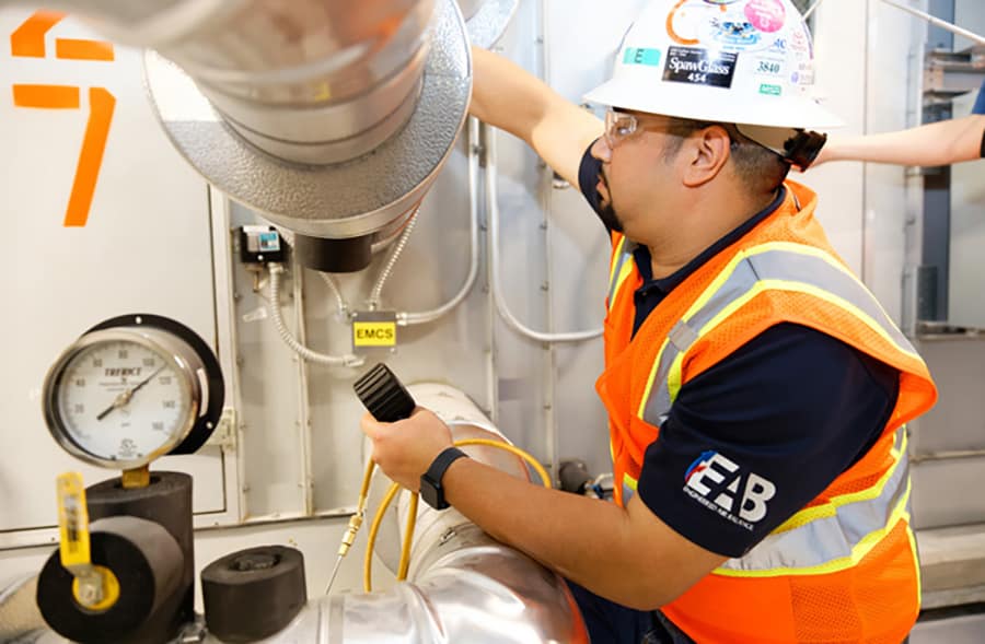 hvac test and balance engineer in action