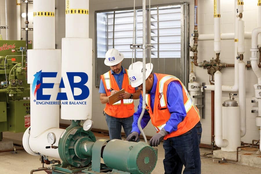 EAB Cx engineers inspecting a commercial plumbing system during commissioning