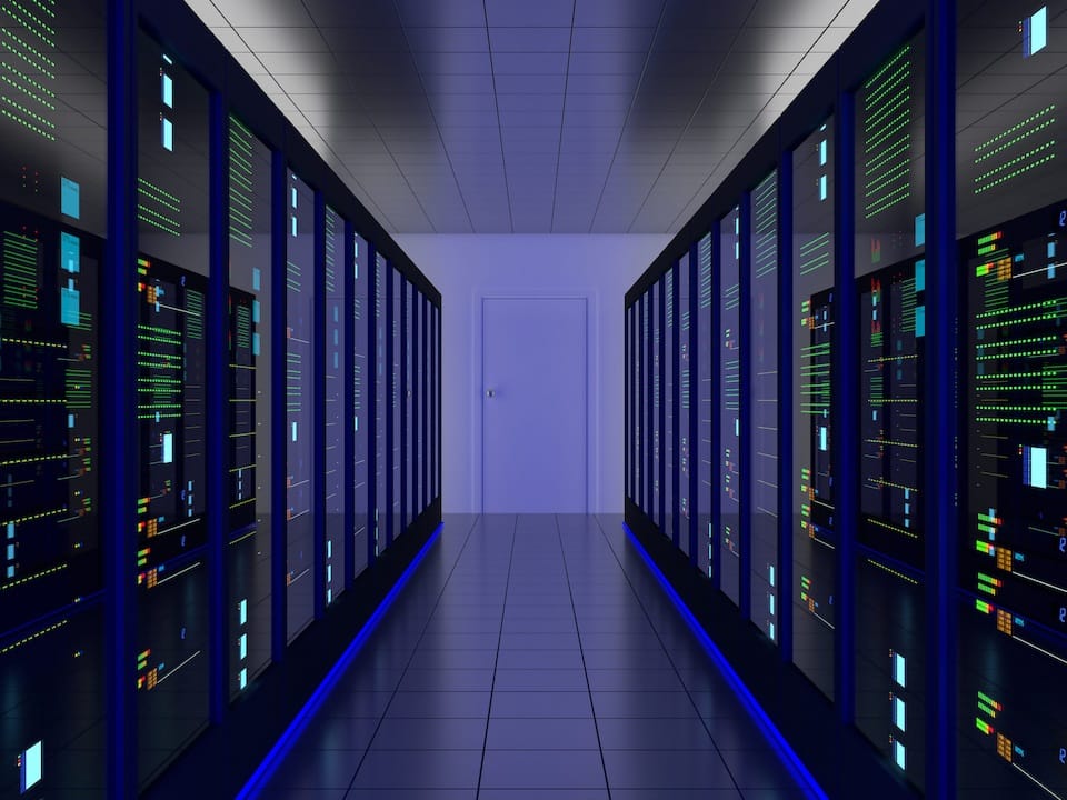 Modern server racks inside a mission-critical facility during data center commissioning and systems testing