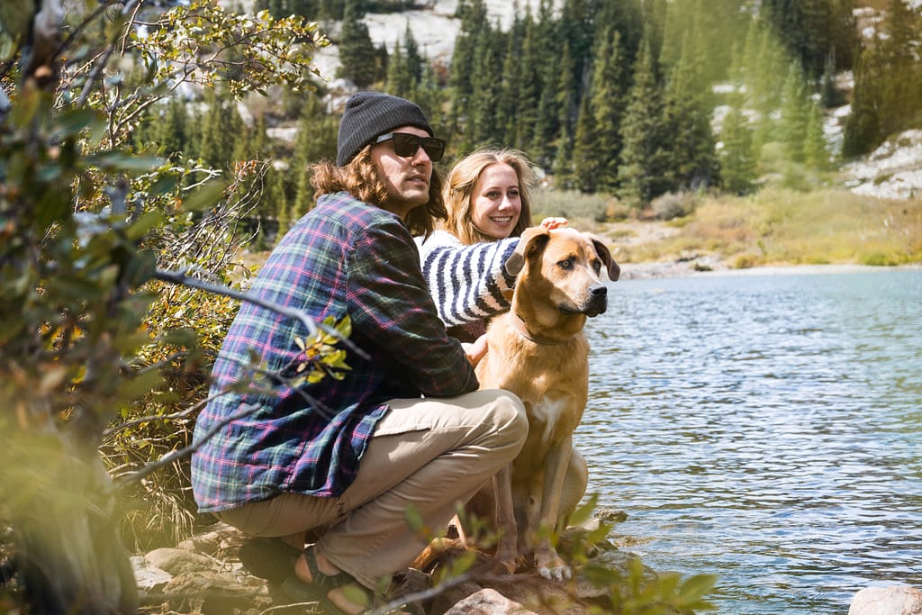 Dog with man and woman in a national park 
