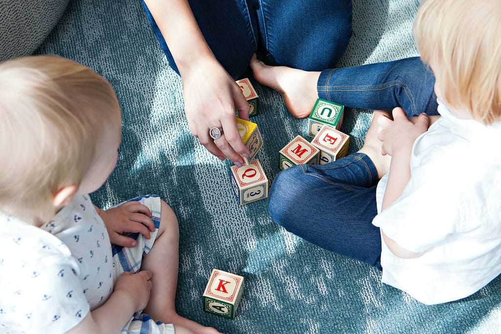 Childcare instructor playing with kids