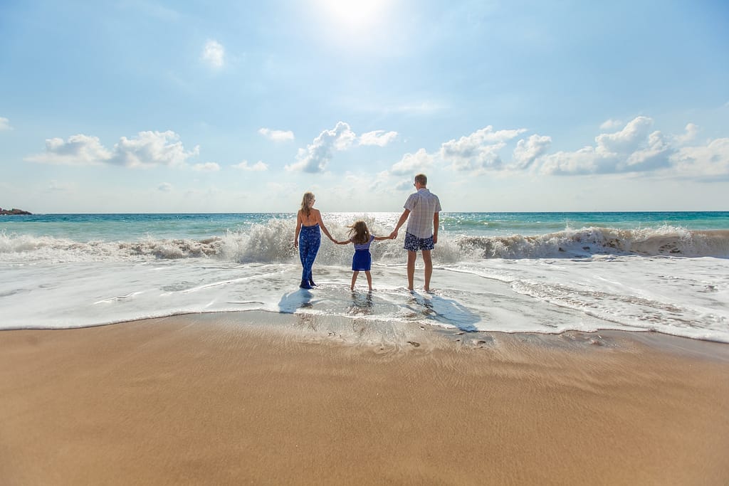 Family enjoying off season travel at the beach