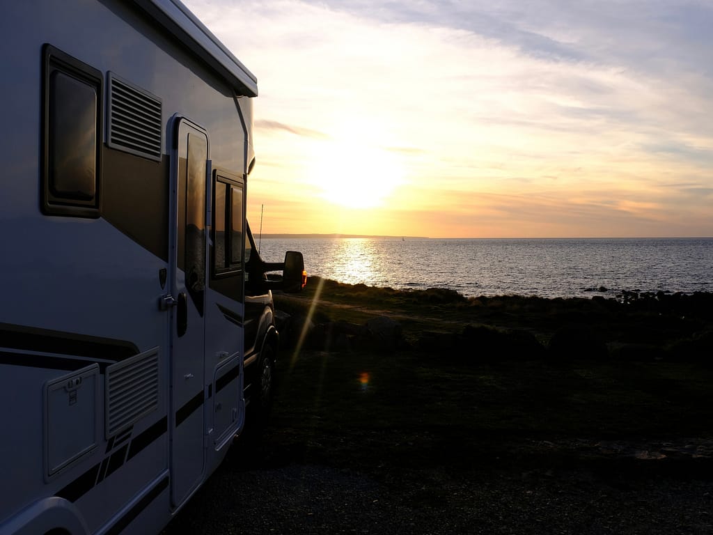 Beach camping in RV at sunset