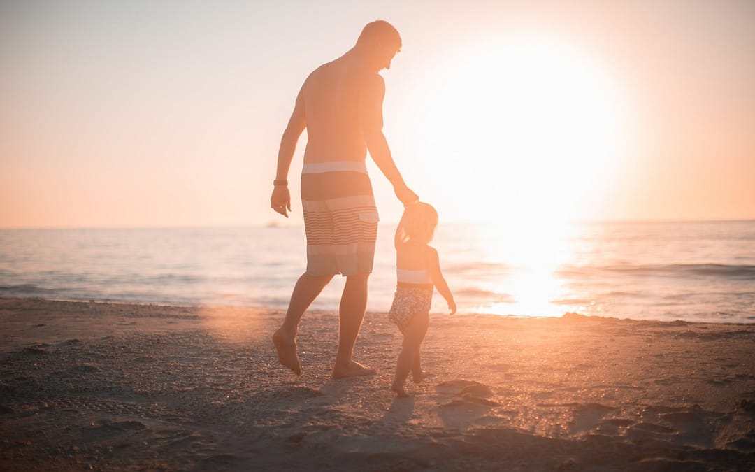 Dad and kid on Florida beach