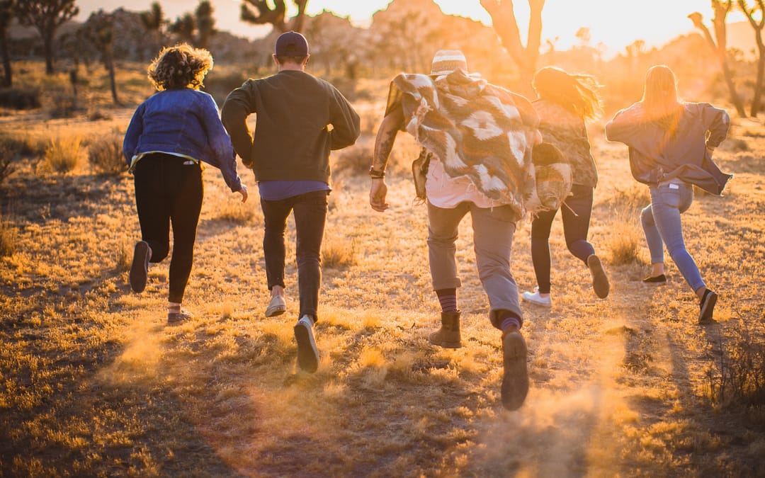 Traveling community of young adults in the desert