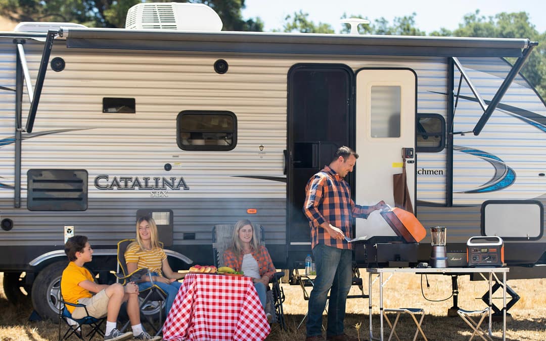 Family in outdoor living space on campsite