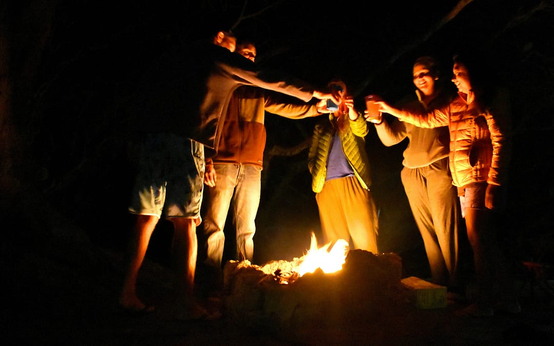 RV New Year celebration with friends around a campfire