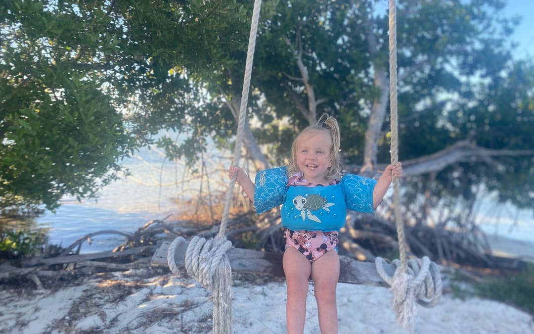 Things to do in Florida: girl on swing in Florida keys