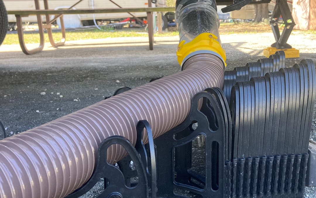 RV sewer hose on an RV sewer hose support