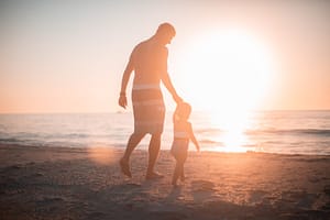 Dad and kid on Florida beach