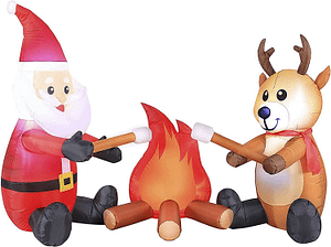 Santa and reindeer roasting marshmallows campsite decoration 