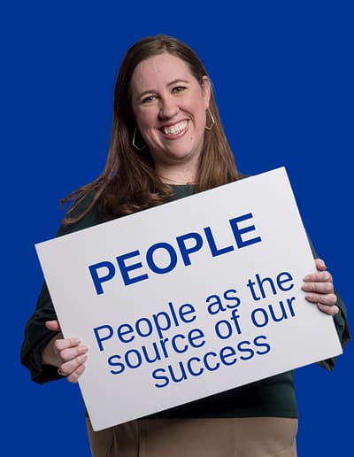 Approachable Advisor Holding People Sign