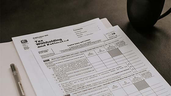 two documents with tax withholding information, possibly about series ee savings bonds