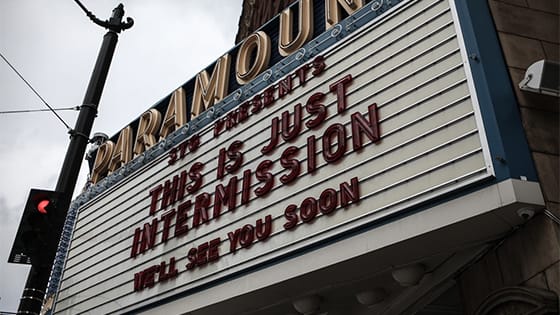 theatre marquee reading "This is just intermission. We