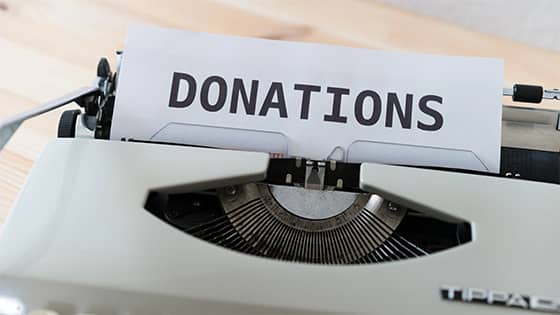 typewriter with paper sticking out with the word "donations;" image used for blog post about not-for-profit donor bill of rights