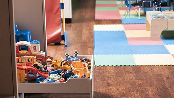 toys and legos sitting in an open draw inside a daycare center; image used for blog post about child care credit under American Rescue Plan Act of 2021