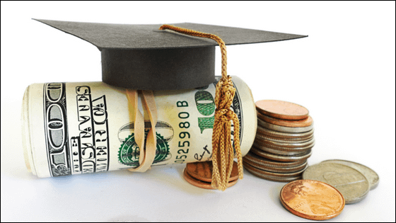 An image of a graduation cap sitting on a roll of dollar bills next to coins; image used for blog post about 529 plan for education tax savings
