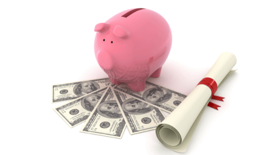 An image of a piggy bank sitting on top hundred dollar bills and a rolled up diploma; for blog post about 5 tax-saving ways to pay for college