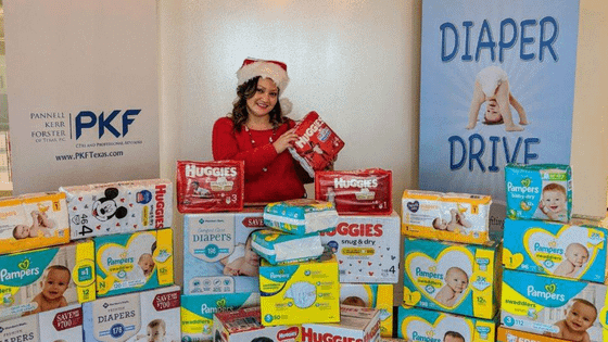 A photo of PKF Texas International Tax Director Nikki Homratsamy posing for a charity diaper drive; for blog post celebrating Women's History Month