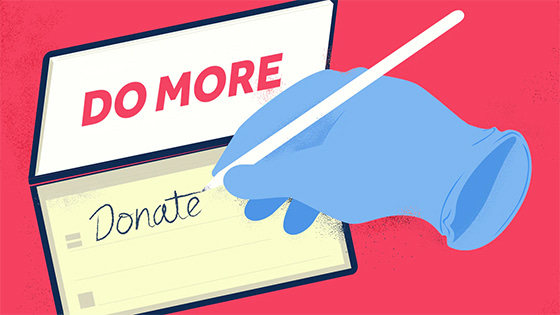 a hospital glove holding a pen and writing "donate" in a checkbook