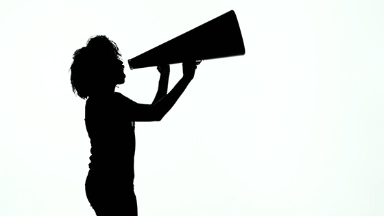 silhouette of a woman shouting through a megaphone; image used for blog post about not-for-profit cause marketing
