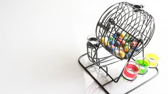 A photo of a bingo wire rolling basket with balls with numbers for bingo; image used for blog post about tax rules of gaming for not-for-profits
