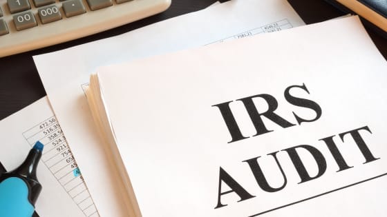 An image of a document with printed words "IRS Audit"