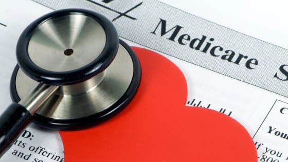 Image: stethoscope on top of a heart and Medicare document