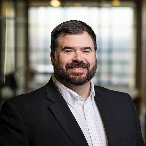 A professional headshot image of PKF Texas Business Advisory Manager Max Gordinier