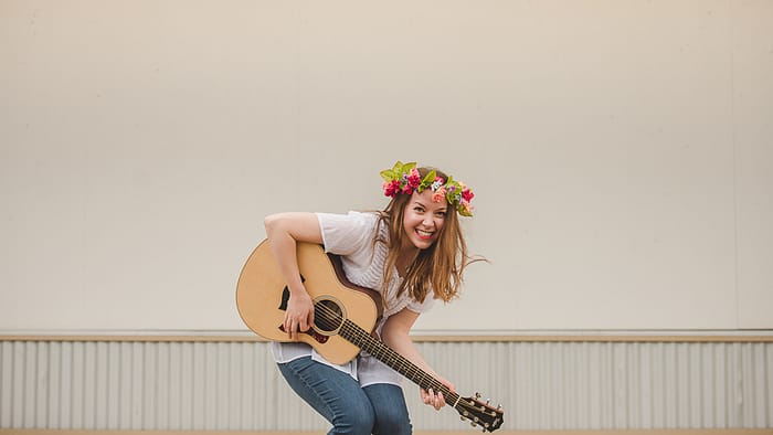 Homeschooled student learns to play guitar