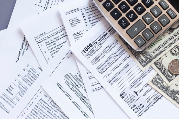 Assorted tax forms and IRS 1040 documents for recordkeeping