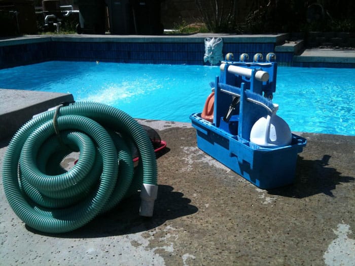 pool-cleaning hose and cleaning brushes