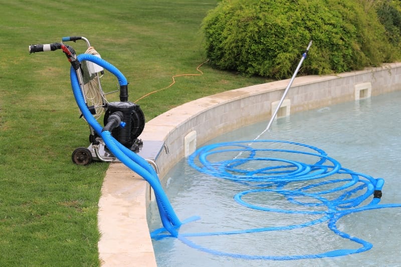 a pool with blue hoses